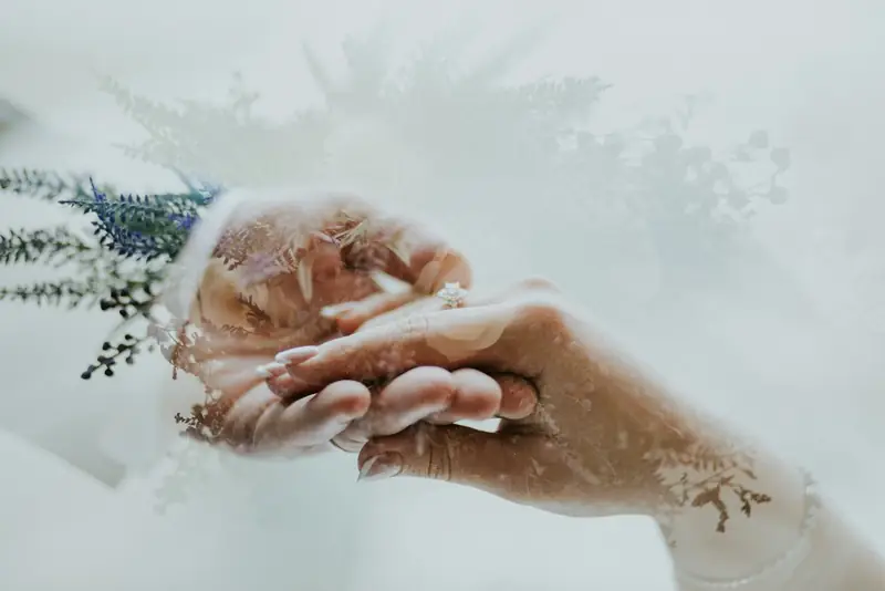 Delicate hands holding florals