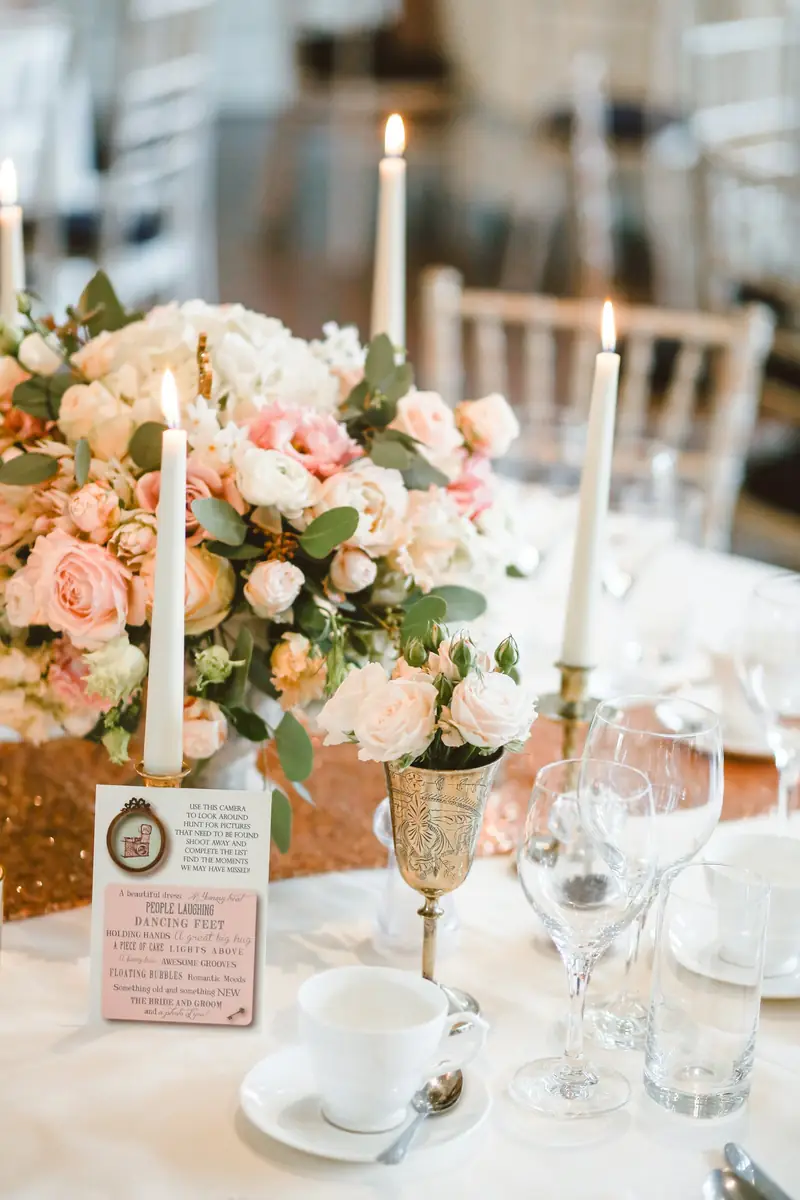 Candlelit table with flowers set for a cozy evening at home